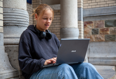 Student in secondary education working on a laptop from Signpost